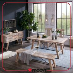 a wooden table and chairs in a room next to a window with potted plants