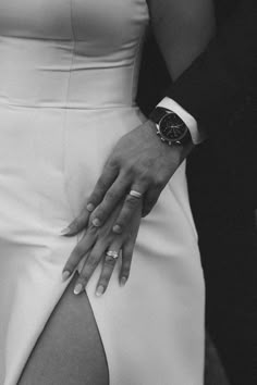 black and white photograph of a woman's dress with her hands on her hips