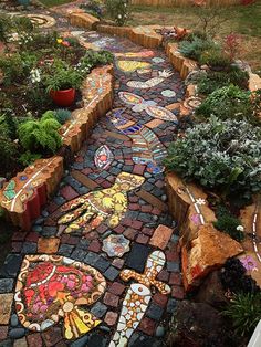 a garden path made out of bricks and stones