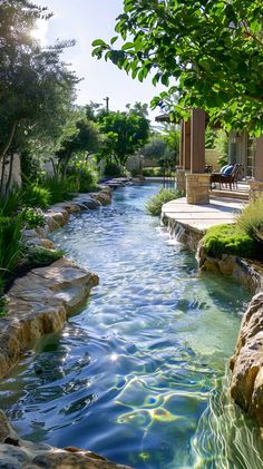 a small stream running through a lush green park