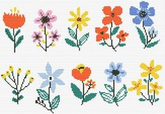 cross stitch flowers are shown in different colors