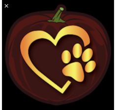 a heart shaped pumpkin with a paw print on the front and bottom, as well as a dog's paw