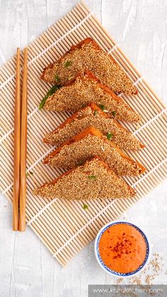 sesame praw toast with dipping sauce and chopsticks