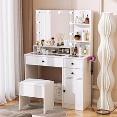 a white vanity with lights on it and a stool in front of the mirror that is open