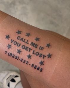 someone with a tattoo on their arm that says, calm me if you get lost