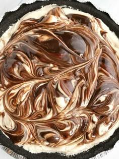 a pie with chocolate swirled on top