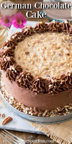 a german chocolate cake with nuts on top