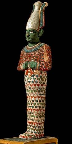 an egyptian statue is shown on display