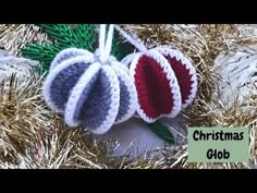 three crocheted christmas ornaments hanging from a tinseled tree branch with the words christmas