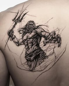 the back of a man's shoulder with a drawing of a demon on it