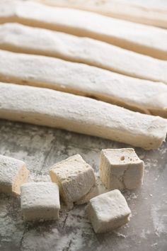 bread sticks and marshmallows on a baking sheet