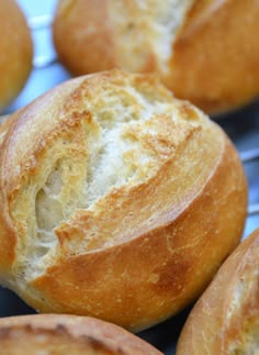 bread rolls sitting on top of a cooling rack