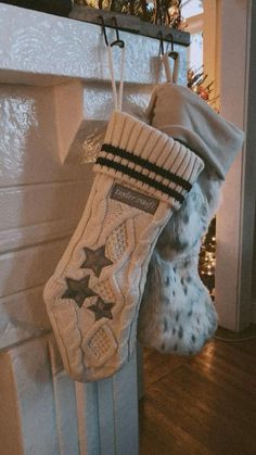 a christmas stocking hanging from a fireplace