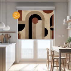 a kitchen with white cabinets and an abstract design on the window sill above it