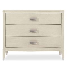 a white dresser with three drawers