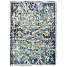 an area rug with blue and green colors