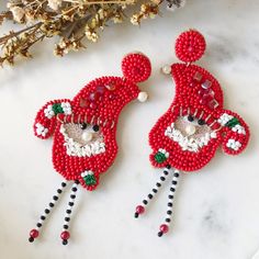 "Santa Earrings, Christmas Earrings, Holiday Jewelry, Christmas Party, Secret Santa Gift, Stocking Gifts, Holiday Earrings, Beaded Earrings These cute Santa earrings are the perfect Christmas Day earrings, Christmas party, or secret Santa gift. Lightweight and comfortable to wear, these beaded dangle Christmas Santa earrings are approximately 8cm long (3.14\") It's the most wonderful time of the year, make it even more fun with these sweet Santa and candy cane drop earrings." Handmade Christmas Earrings For Celebration, Beaded Earrings For Christmas Party, Handmade Earrings For Holiday Festivities, Handmade Earrings For Holiday Celebrations, Holiday Handmade Earrings For Celebration, Handmade Earrings For Celebrations And Holidays, Handmade Festive Earrings For Christmas, Christmas Party Beaded Earrings, Handmade Beaded Earrings For Holiday Party