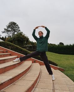 a man is doing yoga on some steps