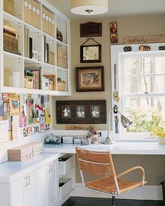 a chair sitting in front of a window next to a desk