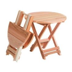 two wooden folding chairs and a table with one chair sitting on it's side