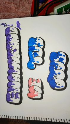 the letters are painted in different colors and shapes on a sheet of paper with markers