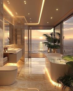 a bathroom with a large bathtub next to the ocean