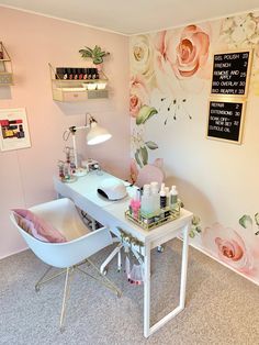 a room with a desk, chair and flowers on the wall