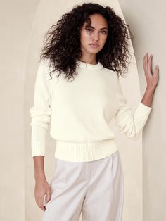 We designed this sweater to stun through all seasons cutting it in a not-too-tight silhouette with extra-long sleeves so it still feels modern.  For materials, we selected a beautiful yarn spun from breathable cotton and luxuriously soft silk.  Semi-fitted.  Extra-long sleeves.  Crew neck.  Raglan sleeve seam detail.  Straight hem.  Semi-fitted.  Extra-long sleeves.  Hip length.  Model: Size S, 5'10" (178cm). Extra Long Sleeves, Outerwear Sweater, Cotton Sweater, Popular Style, Cotton Silk, Wedding Outfit, Fall Fashion, Raglan Sleeve, All Seasons