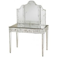 an antique vanity with mirrored top and drawers