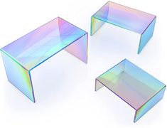 three tables made out of holographic glass, each with different shapes and sizes