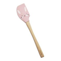 a pink spatula with a cat face on it