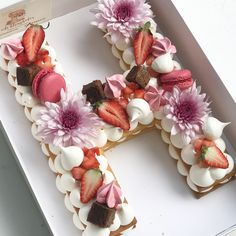 the letter h is decorated with strawberries and flowers