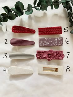 several different types of hair clips on a table