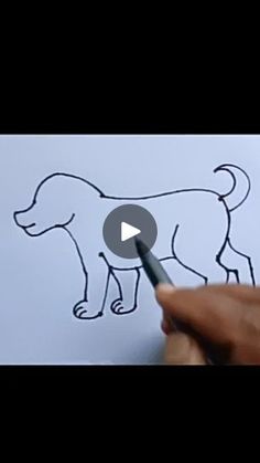 someone drawing a dog on paper with a marker