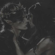 two women are kissing in the dark with leaves on their head and one is wearing a crown