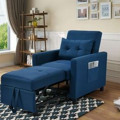 a blue chair and ottoman in a living room