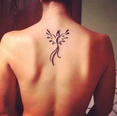 a woman with a tattoo on her back