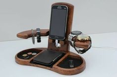 a cell phone is sitting on top of a holder with keys and other items in it