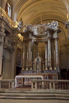 the interior of a church with an ornate alter