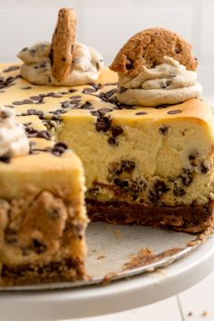 a cheesecake with chocolate chips and cookies on top