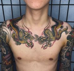 a man with dragon tattoos on his chest