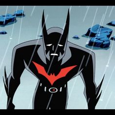 the animated batman is standing in the rain