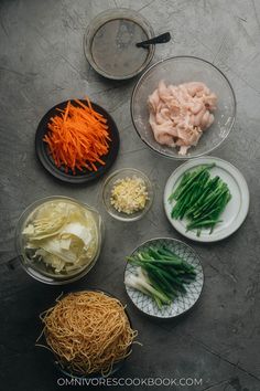 several bowls filled with different types of food