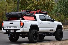 a white truck is parked on the side of the road