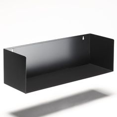 an empty black shelf on a white background