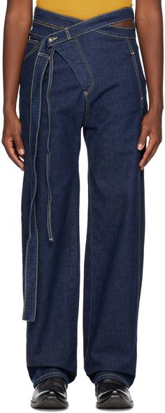 Stretch cotton-blend denim jeans. · Wrap construction · Belt loops, cutouts, and extended belt straps at modified waistband · Five-pocket styling · Offset button-fly · Rubberized logo patch at back waistband · Contrast stitching in yellow Available exclusively at SSENSE. Supplier color: Deep blue Wrap Jeans, Vetements Jeans, Baby Keem, Reworked Jeans, Chic Clothing Style, Mood Board Fashion, Denim Outfit, Denim Pant, Contrast Stitch