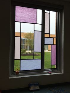 a window that has some kind of colorful glass on it