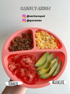 a person holding a pink plate with different foods in it, including tomatoes, avocado and rice