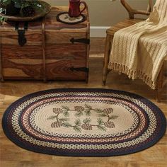 a living room with furniture and rugs on the floor