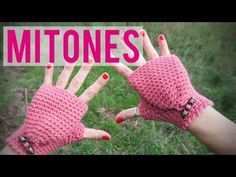 two hands wearing pink knitted gloves with the words mitones on them